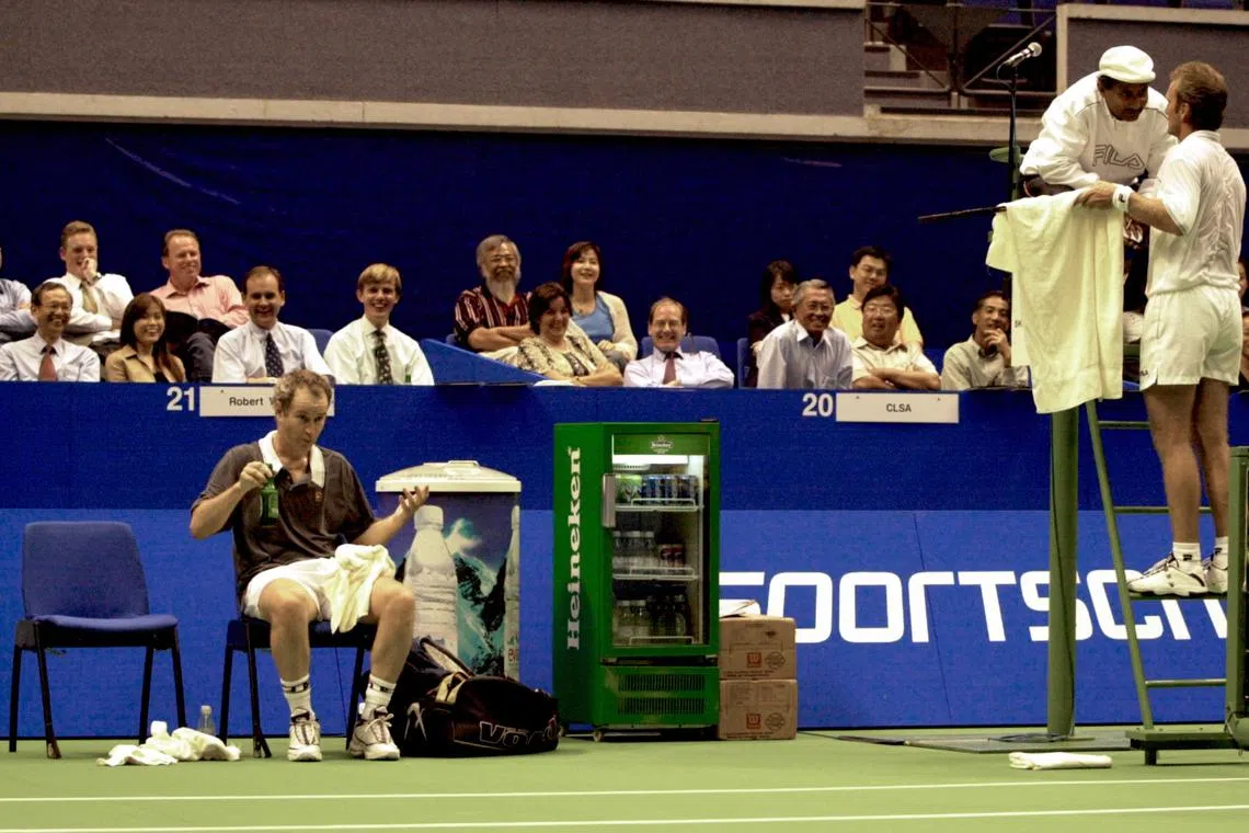 Australian tennis legend Peter McNamara complaining to the umpire during his match against American John McEnroe in the M1 Motorola Champions 2000 tournament. 