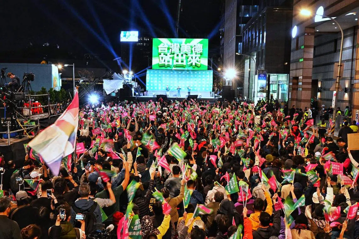 ST20240113_202434766456/Chong Jun Liang/pixtaiwan13/ Supporters cheering at the DPP rally for the Presidential Elections results night in Taipei on Jan 13, 2024.