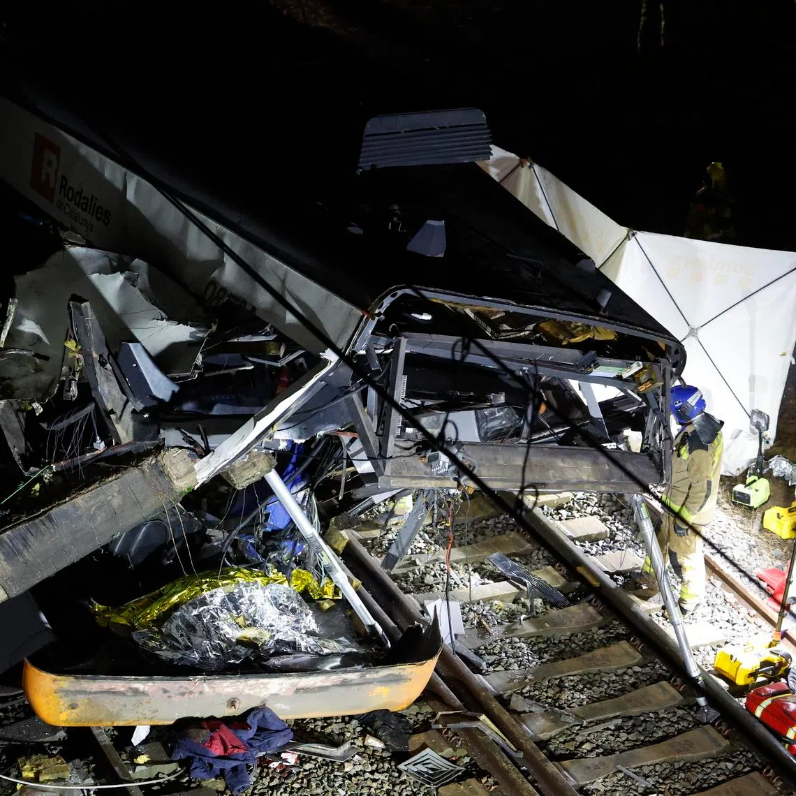 A commuter train derailed after a containment wall fell on the track due to heavy rain near Barcelona, Spain, on Jan 20.