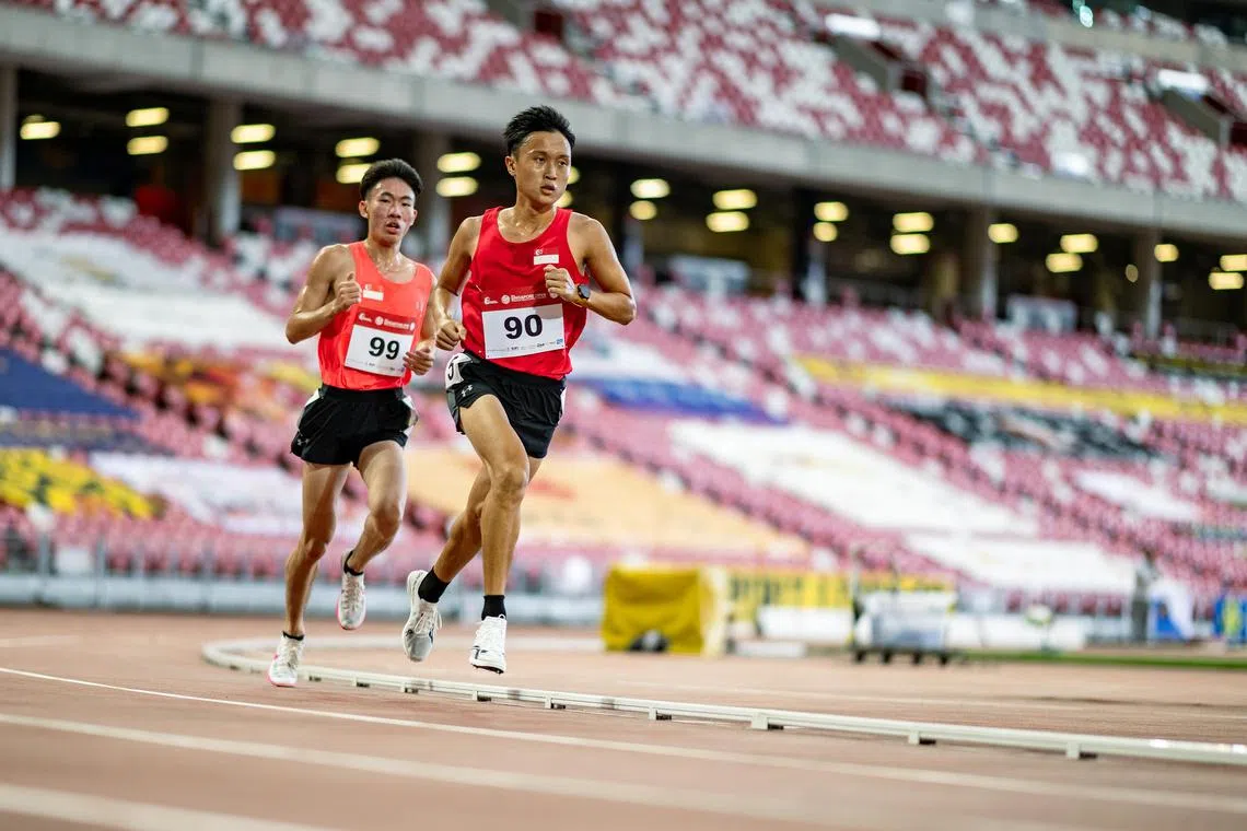 National runner Shaun Goh (right) broke the national record for the 10km road race at the Run Prix in Melbourne on Sept 22.