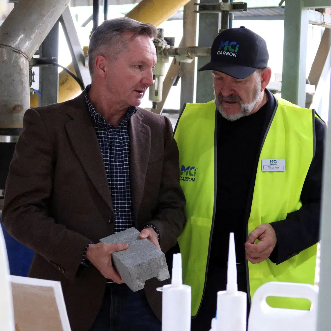 FILE PHOTO: Australian Energy Minister Chris Bowen and MCi Carbon's CEO Marcus Dawe at the carbon refinery facility in Newcastle, Australia, June 17, 2026. REUTERS/Cordelia Hsu/File Photo