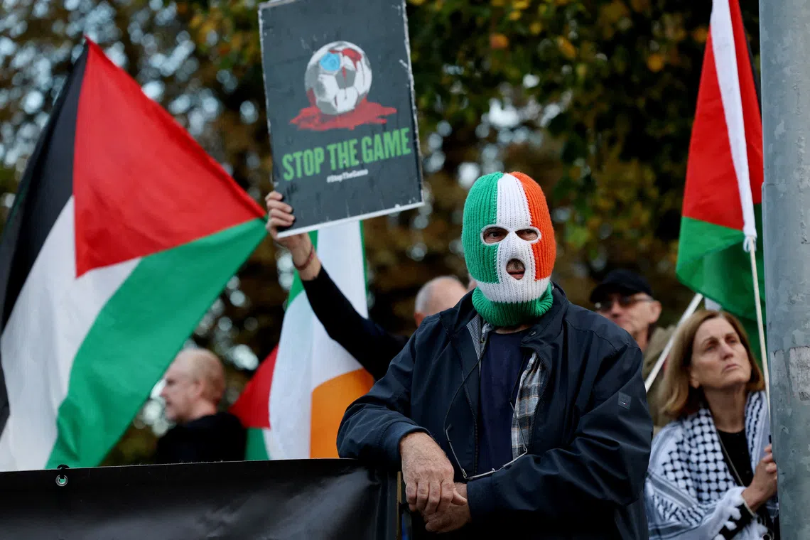 Soccer Football - UEFA Nations League - Group B3 - Republic of Ireland v Austria - Aviva Stadium, Dublin, Ireland - October 1, 2026 General view of a man wearing a balaclava during a \"Stop The Game\" protest before the match REUTERS/Cathal Mcnaughton