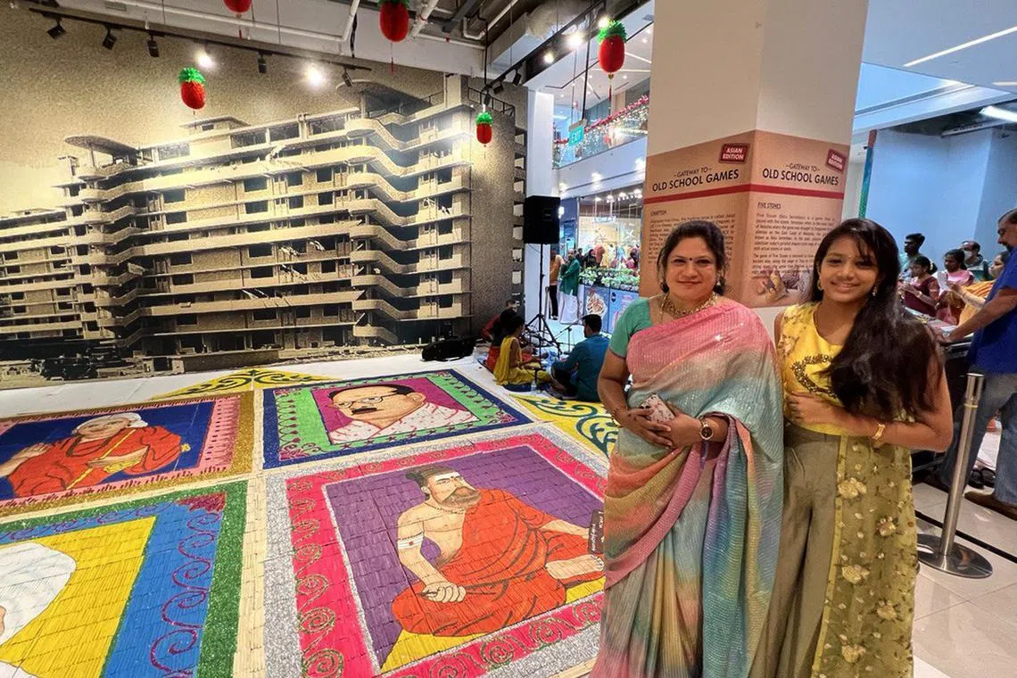 Mrs Sudha Ravi (left) and her daughter Rakshita posing with their artwork at an event on Jan 21 to celebrate Pongal.