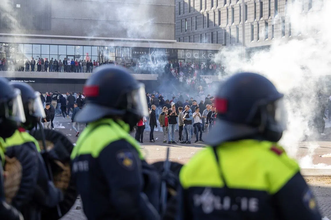 Riot police is deployed around the Johan Cruijff ArenA after the football match between Ajax Amsterdam and Feyenoord Rotterdam.