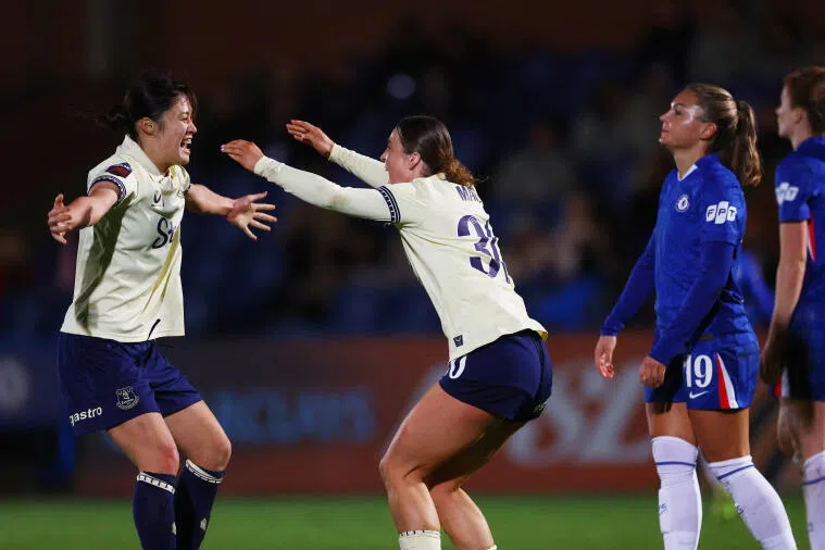 Everton's Rion Ishikawa and Ruby Mace celebrate after the match.