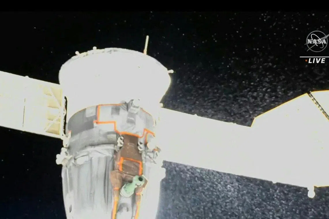 (FILES) This file video grab from a NASA feed obtained December 15, 2022 shows liquid spraying from the aft end of the Soyuz MS-22 spacecraft. - The Russian space agency said on January 11, 2023 that its damaged Soyuz spacecraft needs to return to Earth from the International Space Station without a crew, confirming it was hit by a small meteorite strike. (Photo by HANDOUT / NASA / AFP) / RESTRICTED TO EDITORIAL USE - MANDATORY CREDIT "AFP PHOTO / NASA " - NO MARKETING NO ADVERTISING CAMPAIGNS - DISTRIBUTED AS A SERVICE TO CLIENTS