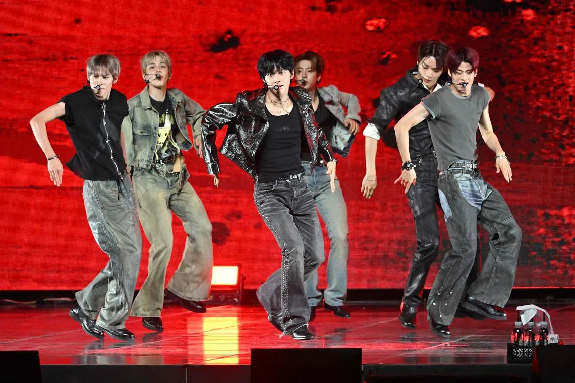 Members of K-pop boy group RIIZE perform during a showcase for their first mini album "RIIZING" in Seoul.