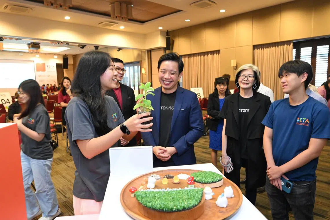 cwbeta - Mr Alvin Tan, Minister of State for the Ministry of Trade and Industry and the Ministry of Culture, Community and Youth speaking to students from the startup Flourish, during the BETA Programme Showcase at Singapore Polytechnic on Nov 15

PHOTO: SINGAPORE POLYTECHNIC