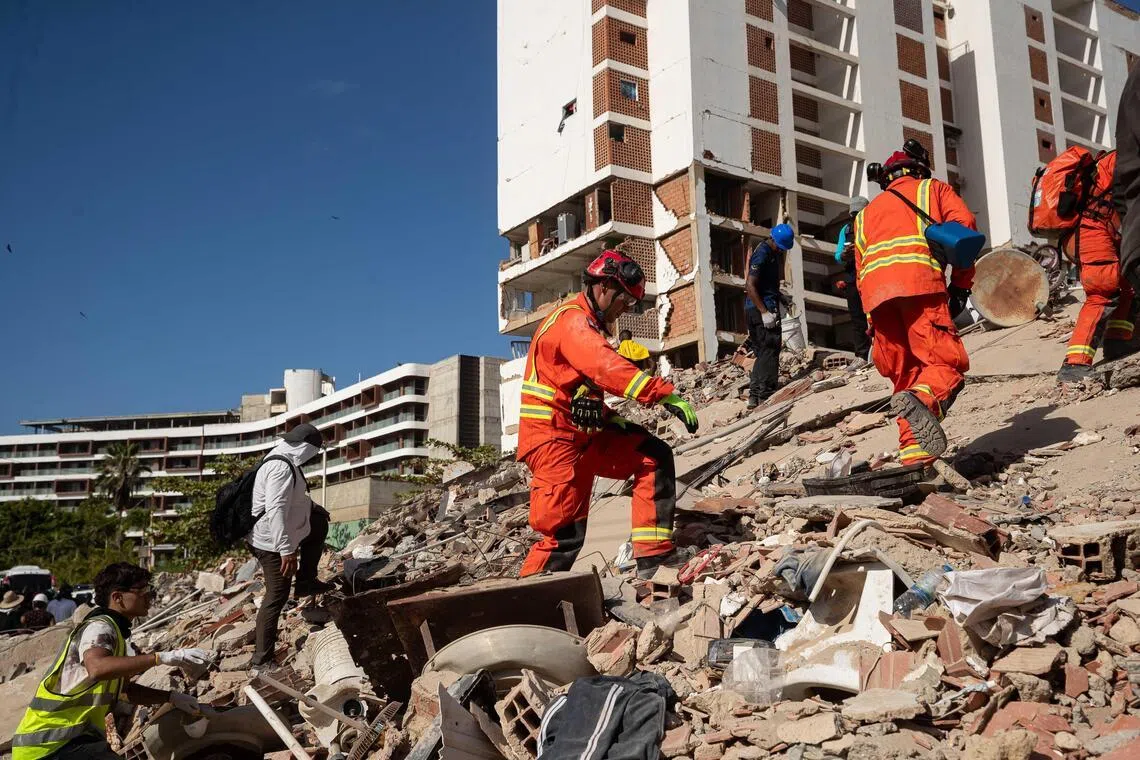 British rescuers search for missing persons in La Guaira, Venezuela on June 29.