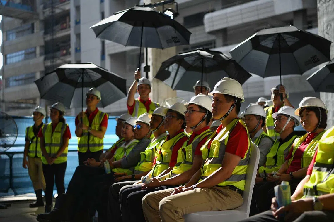 ST20230522_202373507881/amsit22/Shintaro Tay/Amelia Teng/ The Singapore Institute of Technology (SIT) celebrated a major construction milestone for its new Punggol campus with a topping-out ceremony attended by Education Minister Chan Chun Sing on Monday (May 22). Located within the Punggol Digital District, the new SIT Campus is expected to be operational by the second half of 2024 and will be SIT’s home ground.