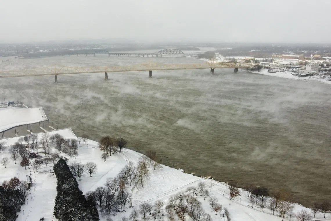 The Ohio River is seen in Louisville, Kentucky, under freezing temperatures on December 23, 2022.  Nearly a million-and-a-half US power customers were in the dark Friday as a severe winter storm walloped the country, causing highway closures and thousands of flight cancellations days before Christmas. Heavy snow, howling winds, and air so frigid it instantly turned boiling water into ice took hold of much of the nation, including normally temperate southern states. 