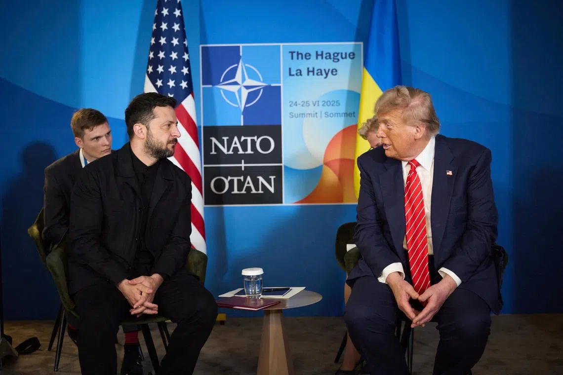 FILE PHOTO: U.S. President Donald Trump and Ukraine's President Volodymyr Zelenskiy attend a meeting on the sidelines of NATO summit in The Hague, Netherlands June 25, 2025. Ukrainian Presidential Press Service/Handout via REUTERS/File Photo