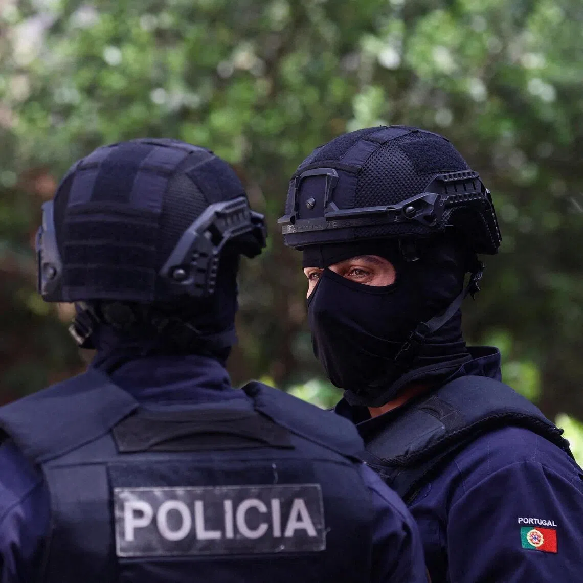 A 2023 photos shows police officers standing guard in Lisbon, Portugal.