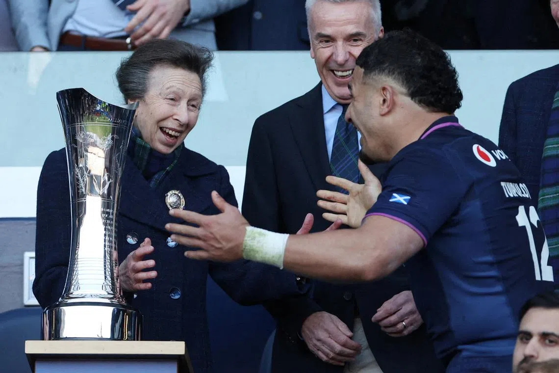 Rugby Union - Six Nations Championship - Scotland v France - Murrayfield Stadium, Edinburgh, Scotland, Britain - March 7, 2026 Scotland's Sione Tuipulotu celebrates with Anne, Princess Royal before lifting the Auld Alliance Trophy after winning their Six Nations Championship match against France REUTERS/Russell Cheyne