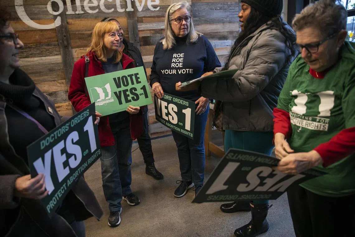 Abortion rights volunteers in Ohio gather to encourage people to vote “yes” to making abortion a constitutional right.