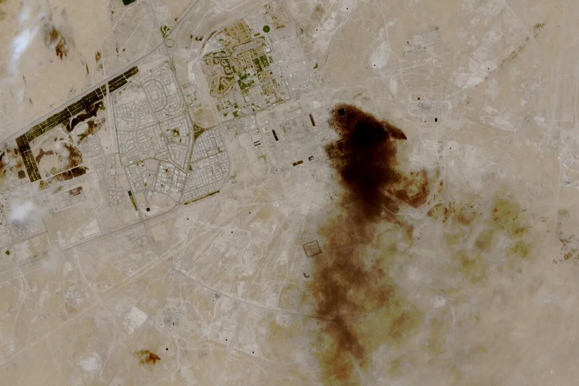 A satellite image shows smoke billowing at a Saudi Aramco oil facility after a reported attack, in Abqaiq, Saudi Arabia, on April 8.
