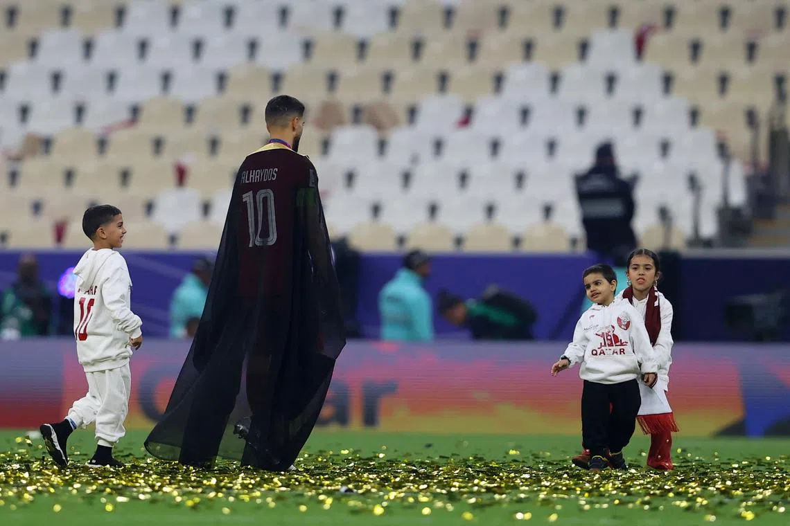 FILE PHOTO: Soccer Football - AFC Asian Cup - Final - Jordan v Qatar - Lusail Stadium, Lusail, Qatar - February 10, 2024 Qatar's Hassan Al-Haydos celebrates after winning the AFC Asian Cup REUTERS/Ibraheem Al Omari/File Photo