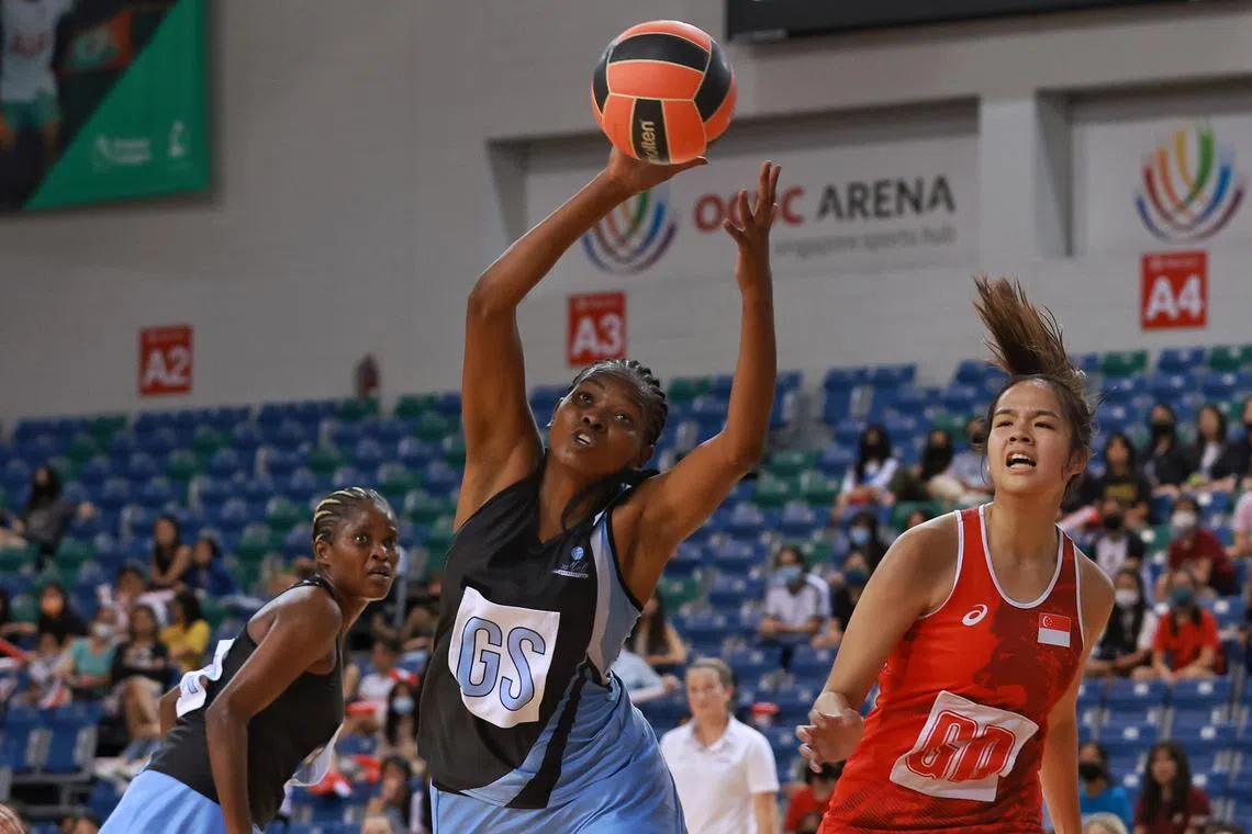 Botswana’s Boikanyo Selogetso (GS) reaching the ball ahead of Singapore’s Jamie Lim (GD) in the Nations Cup 2022 round robin match at OCBC Arena on Dec 6, 2022.