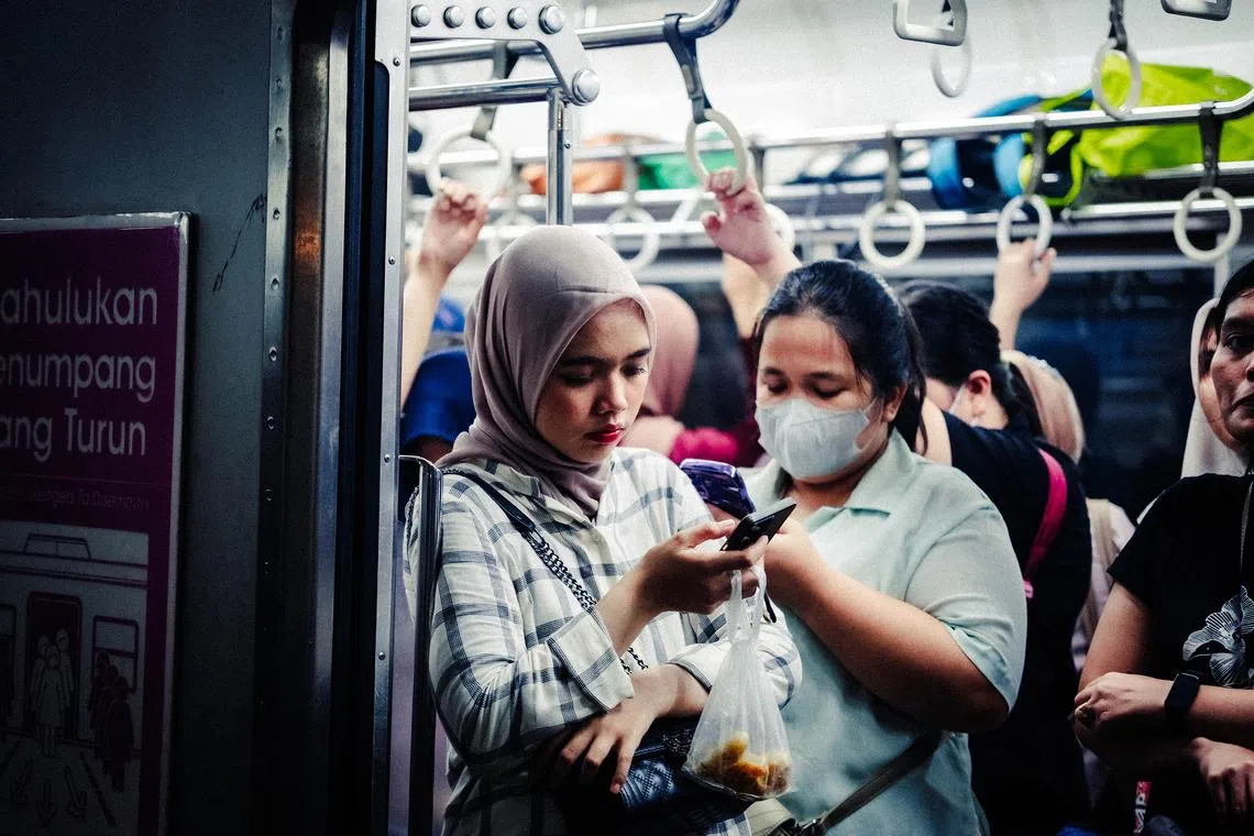A women-only carriage on a Jakarta commuter train in 2025.
