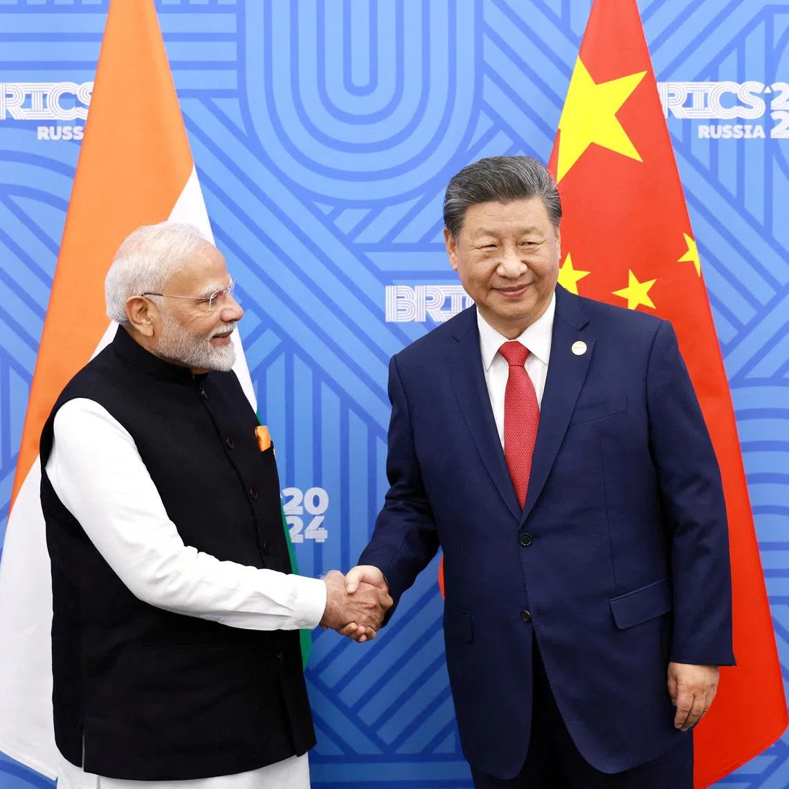 Chinese President Xi Jinping (right) said that over the past year, China-India relations have continued to improve.