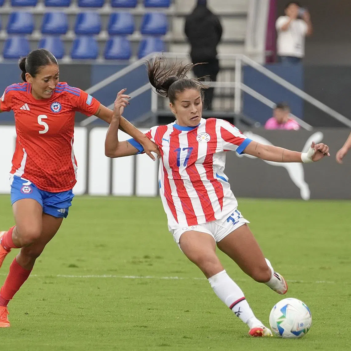 Nayadet Lopez of Chile trying to dispossess Camila Arrieta of Paraguay in their Women's Copa America fifth-place play-off in Quito, Ecuador, on July 28, 2025.