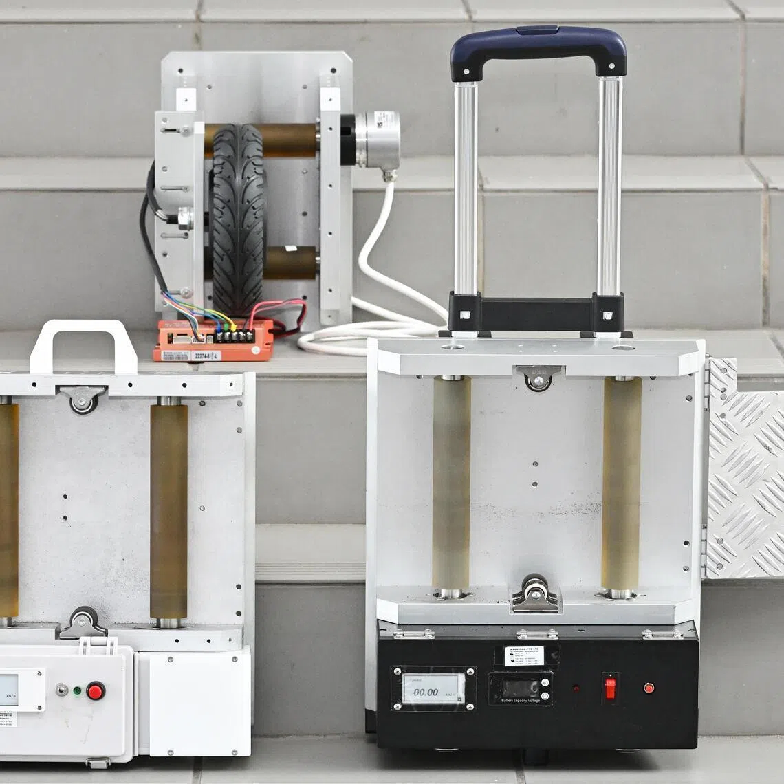 ST20260219-202670000214-Lim Yaohui-Vanessa Paige Chelvan-vcspeed/

Prototypes 1 (top), 2 (left), and 3 (right) of the speed measurement devices to measure top speed of personal mobility devices, at Temasek Polytechnic on Feb 19, 2026.

Interviewing Temasek Polytechnic lecturer and students who developed a speed measurement device for LTA. The device helps LTA officers to detect active mobility devices that have been modified to exceed the maximum speed limit. 

(ST PHOTO: LIM YAOHUI)