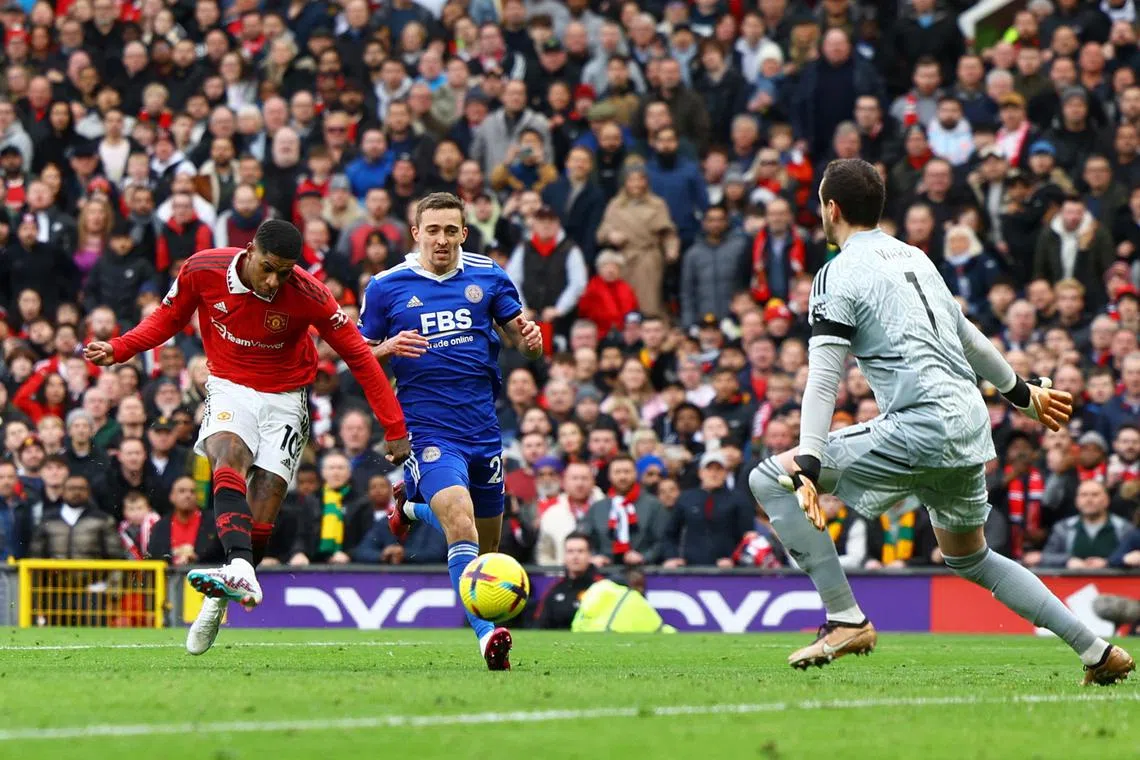 Manchester United forward Marcus Rashford scoring his second goal past Leicester City's Danny Ward at Old Trafford on Sunday. The Red Devils won 3-0.