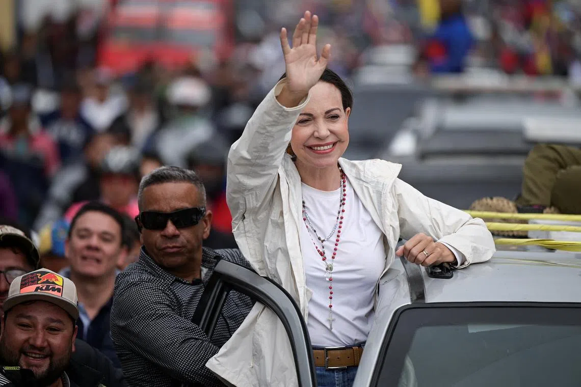 Venezuelan opposition leader Maria Corina Machado greets supporters during a campaign rally for the presidential election, in Merida state, Venezuela June 25, 2024. REUTERS/Gaby Oraa/File Photo