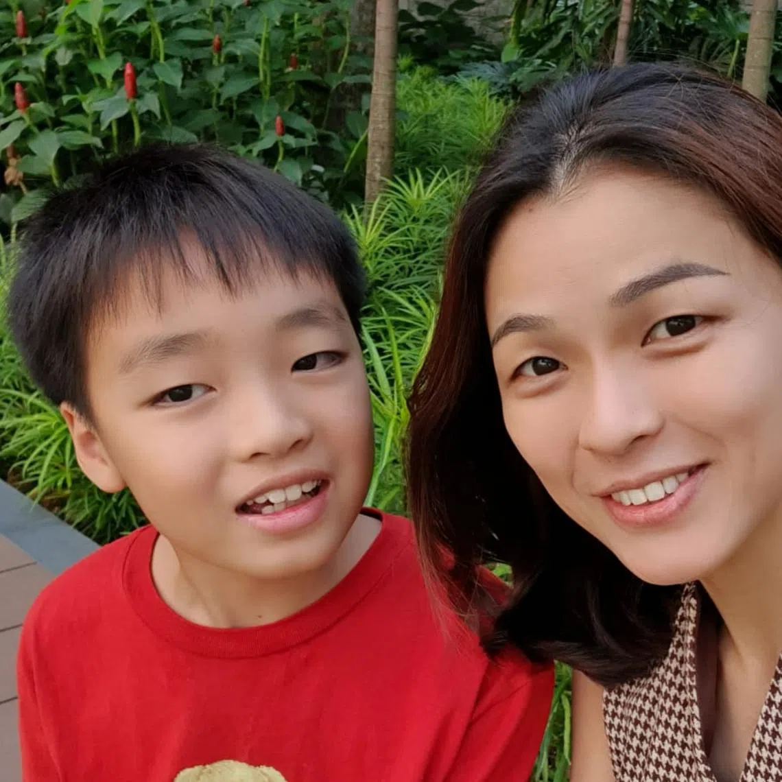 Ms Vanecia Er and her son Austen, who has autism. Ms Er said early diagnosis and intervention for autism helped in Austen’s development.