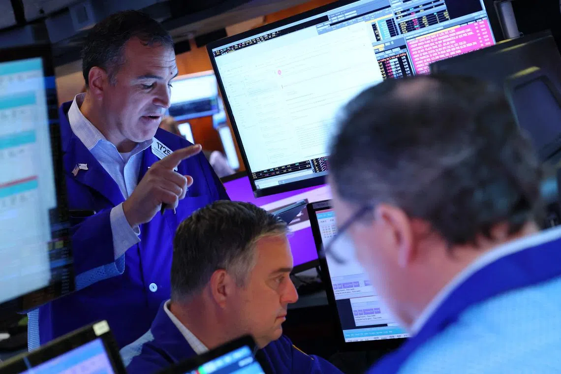 Traders working on the floor of the New York Stock Exchange, during morning trading on May 27, in New York City.