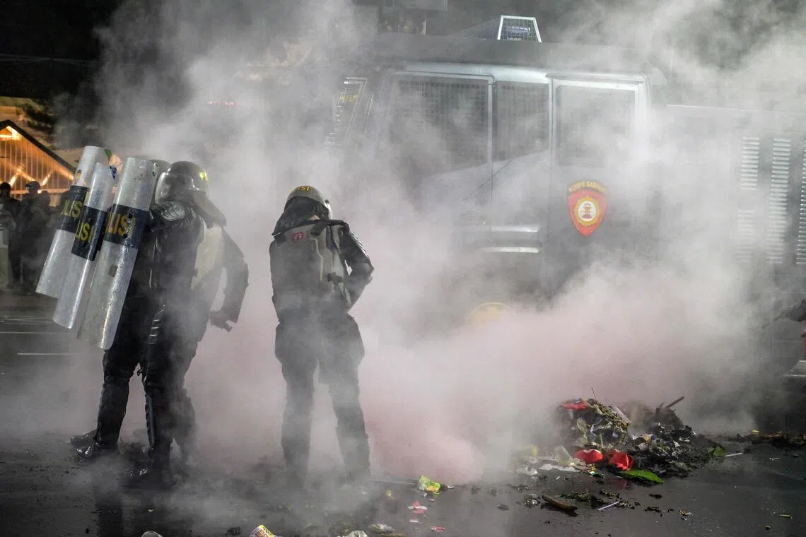 Indonesia police charge four after anti-government protest in Surabaya