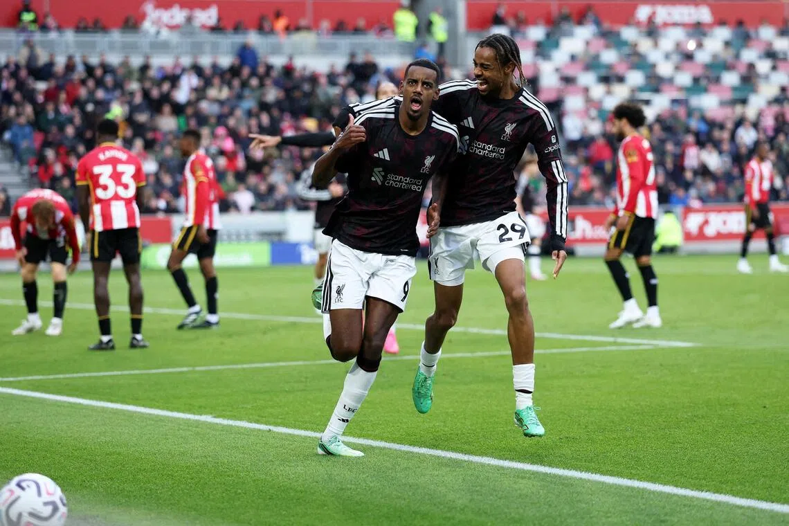 Liverpool’s Alexander Isak celebrates scoring their second goal with Bradley Barcola.