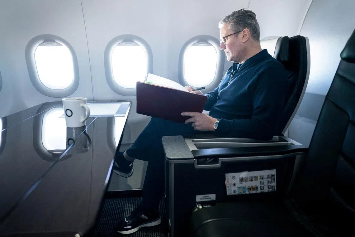 Prime Minister Sir Keir Starmer works on board a Government plane as he travels to Rio de Janeiro, Brazil to attend the G20 summit. Picture date: Sunday November 17, 2024. Stefan Rousseau/Pool via REUTERS