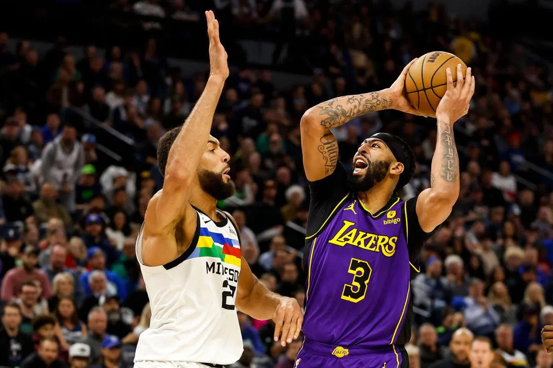 Anthony Davis of the Los Angeles Lakers goes to the basket while Rudy Gobert of the Minnesota Timberwolves defends in the second quarter of the game at Target Centre.
