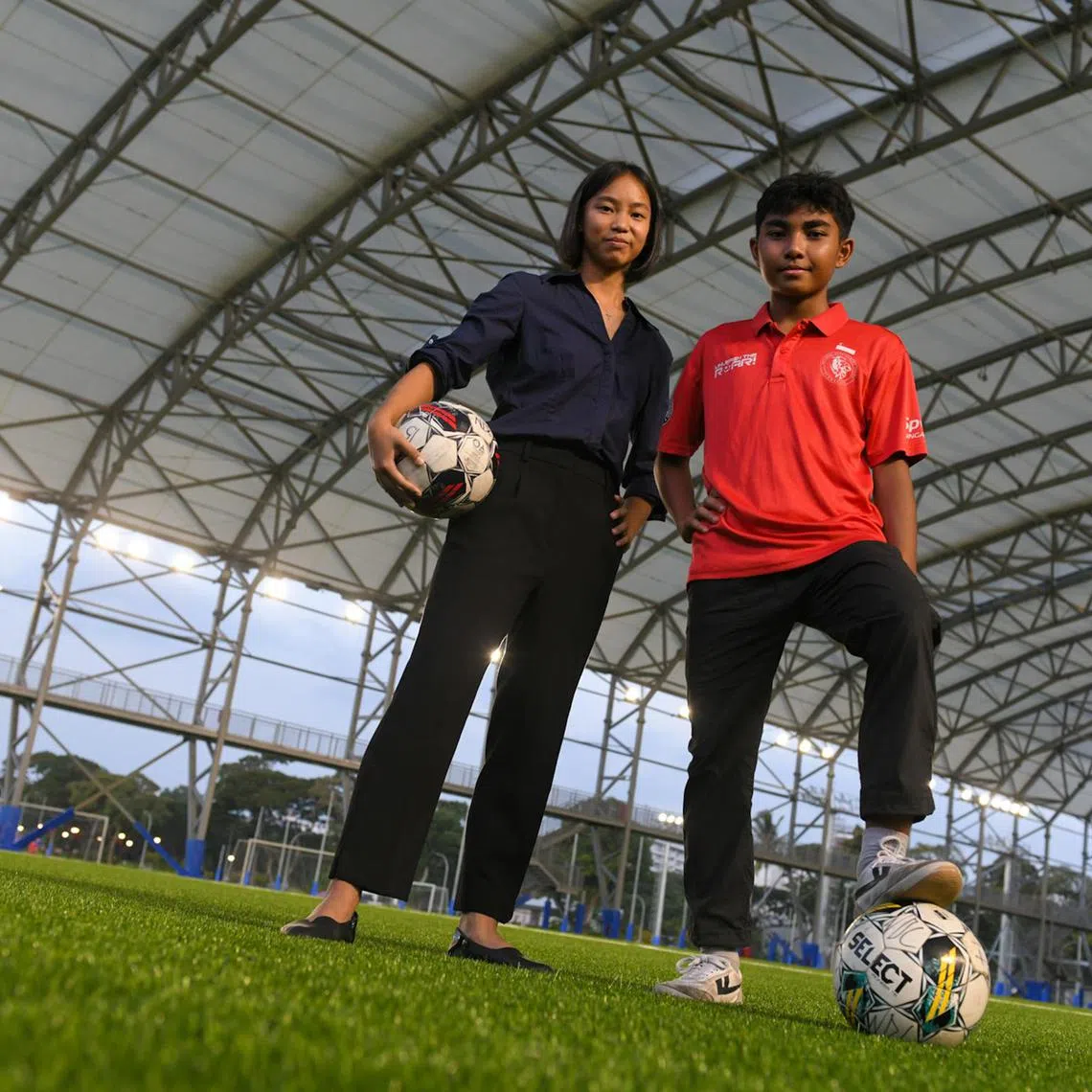 Charis Han En, 17, and Putera Nur Muhammad Irfan Ismail, 14, at the Kallang Football Hub on July 29. They are among nine second-batch recipients of the Unleash The Roar! project overseas scholarship.