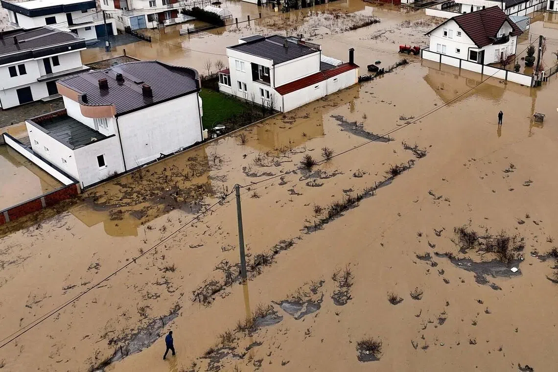 A drone view shows people in a flooded area in Gllogovc, Kosovo, January 6, 2026. REUTERS/Fatos Bytyci TPX IMAGES OF THE DAY