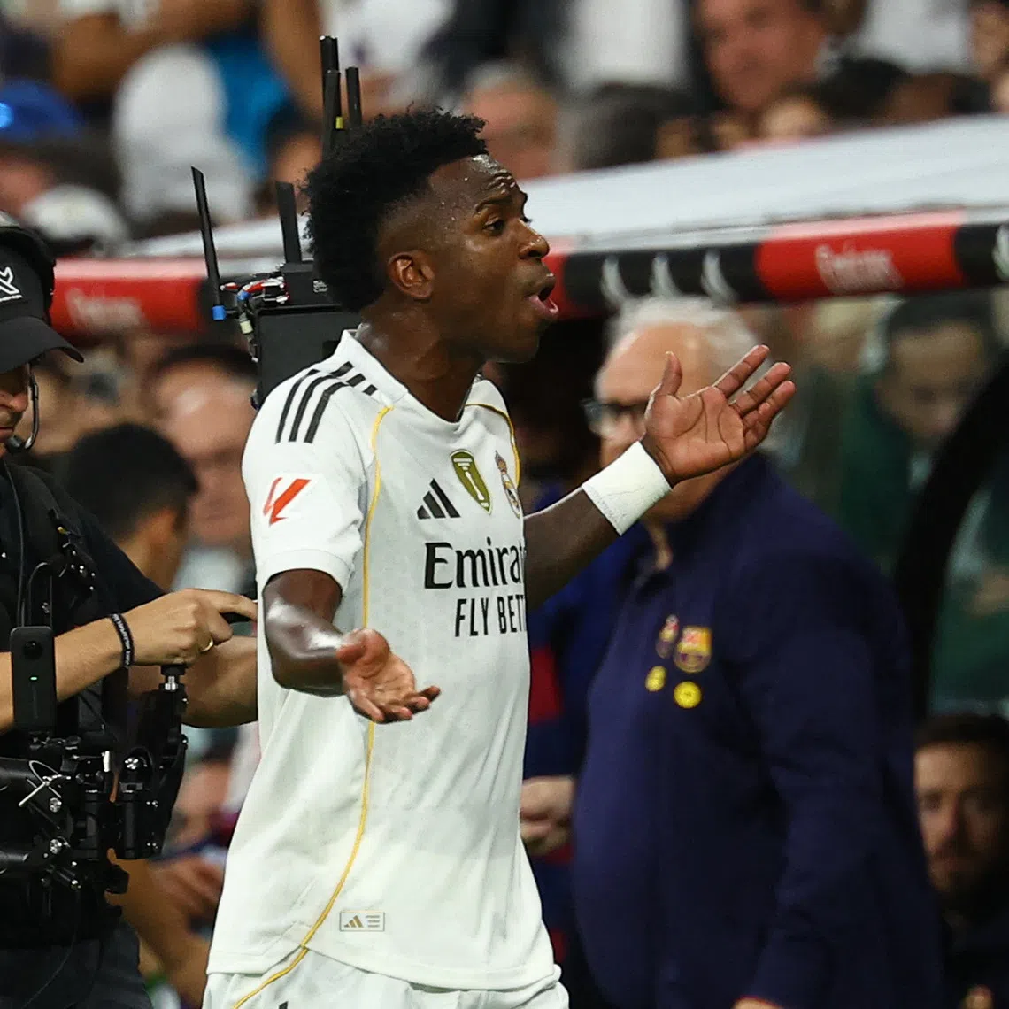 Soccer Football - LaLiga - Real Madrid v FC Barcelona - Santiago Bernabeu, Madrid, Spain - October 26, 2025 Real Madrid's Vinicius Junior reacts after being substituted REUTERS/Susana Vera