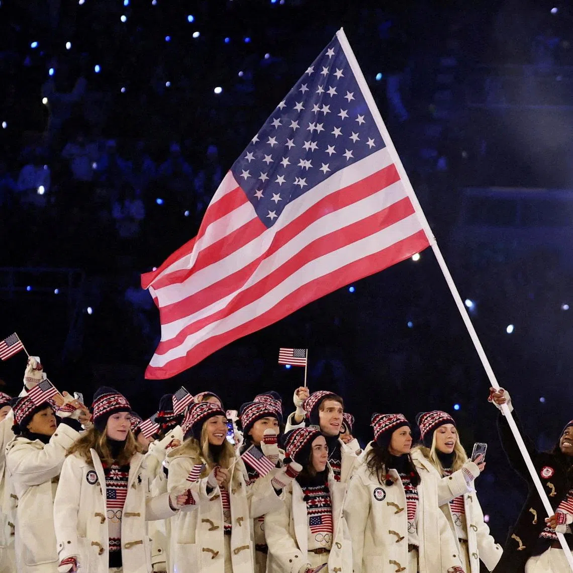 FILE PHOTO: Milano Cortina 2026 Olympics - Opening Ceremony - San Siro Stadium, Milan, Italy - February 06, 2026. Flagbearer Erin Jackson of United States in the athletes parade during the opening ceremony REUTERS/File Photo