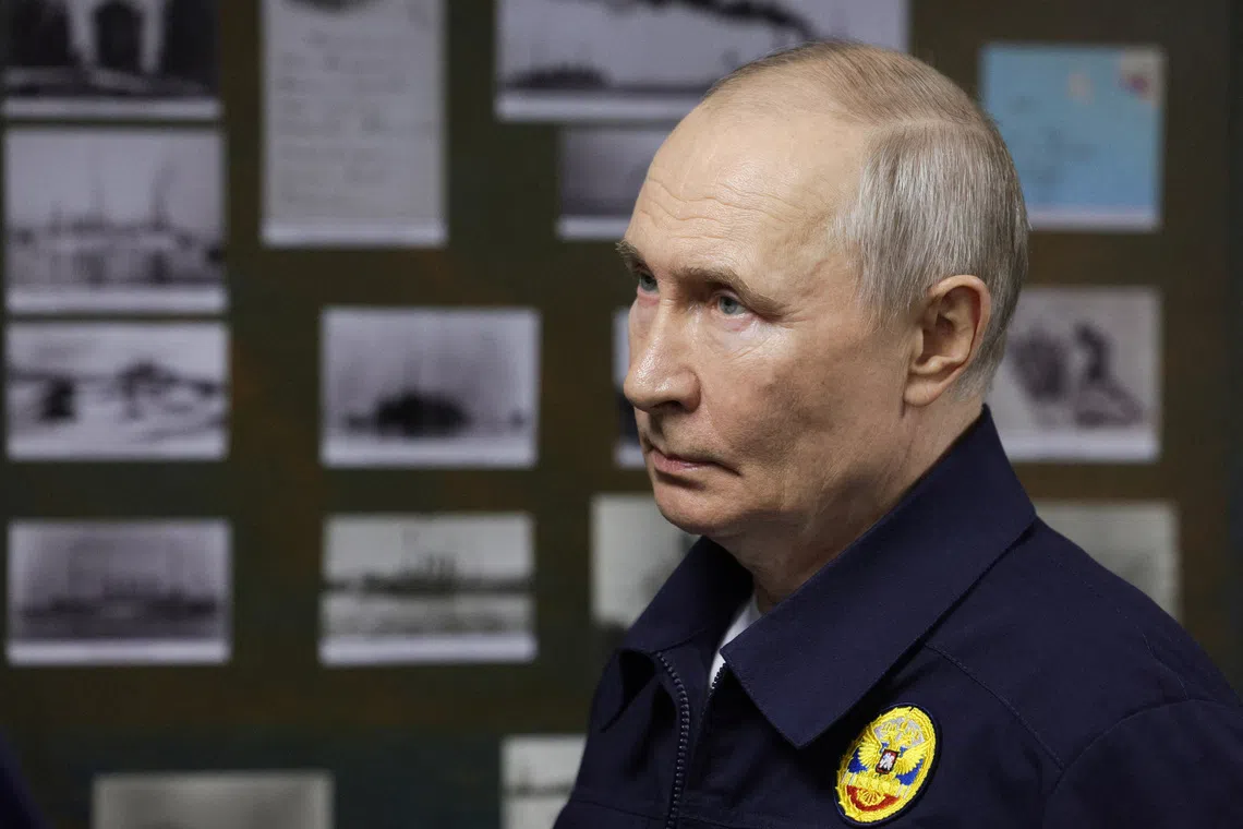 Russia's Putin visits disputed Kuril Islands, samples fish roe, media say