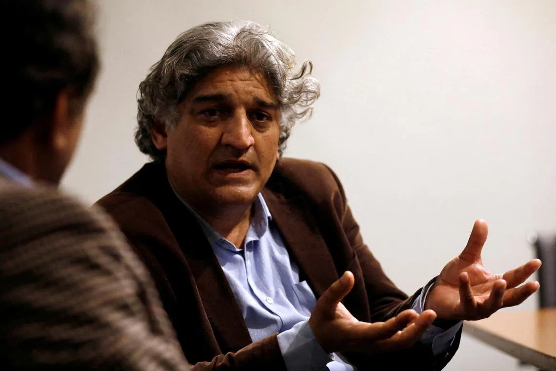 FILE PHOTO: Matiullah Jan, a journalist and columnist, gestures during an interview with Reuters at his office in Islamabad, Pakistan March 13, 2019. REUTERS/Akhtar Soomro/File Photo
