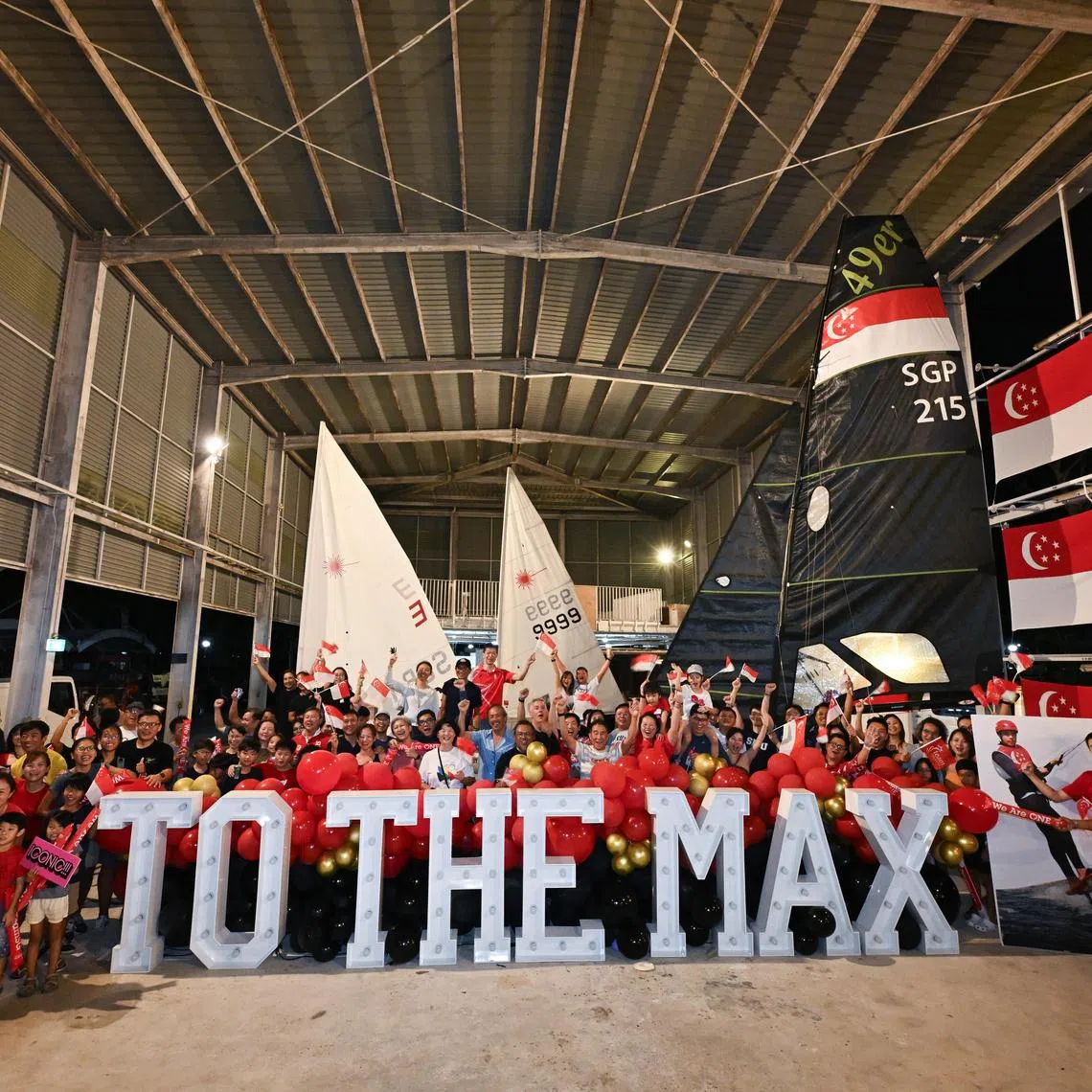 Supporters of Maximilian Maeder taking a group photograph at National Sailing Centre after the final is postponed.