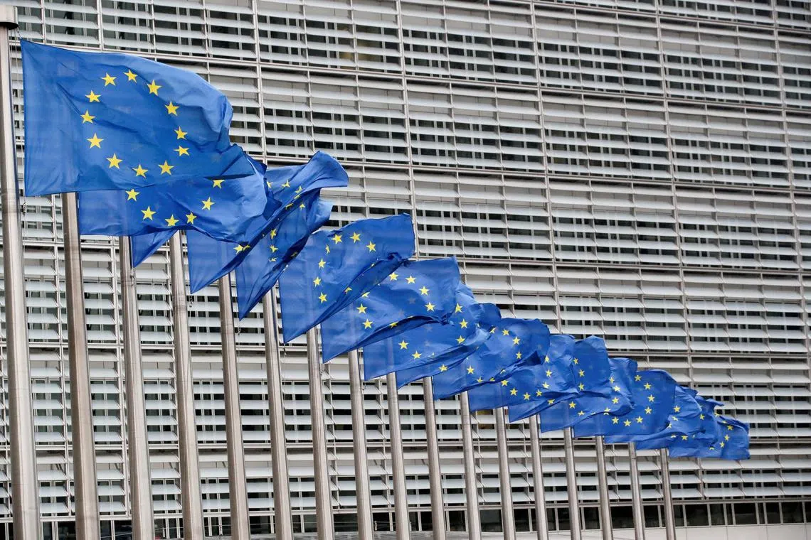 FILE PHOTO: European Union flags flutter outside the EU Commission headquarters in Brussels, Belgium, July 14, 2021. REUTERS/Yves Herman/File Photo