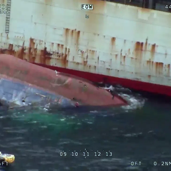Coast Guard personnel carry out a rescue operation after a vessel capsized off Busan.