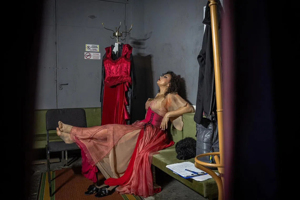 Veronika Koval, a mezzo-soprano, rests before performing in “The Marriage of Figaro” at the National Academic Opera and Ballet Theater in Kharkiv, Ukraine, where productions are now largely held underground, on June 13.