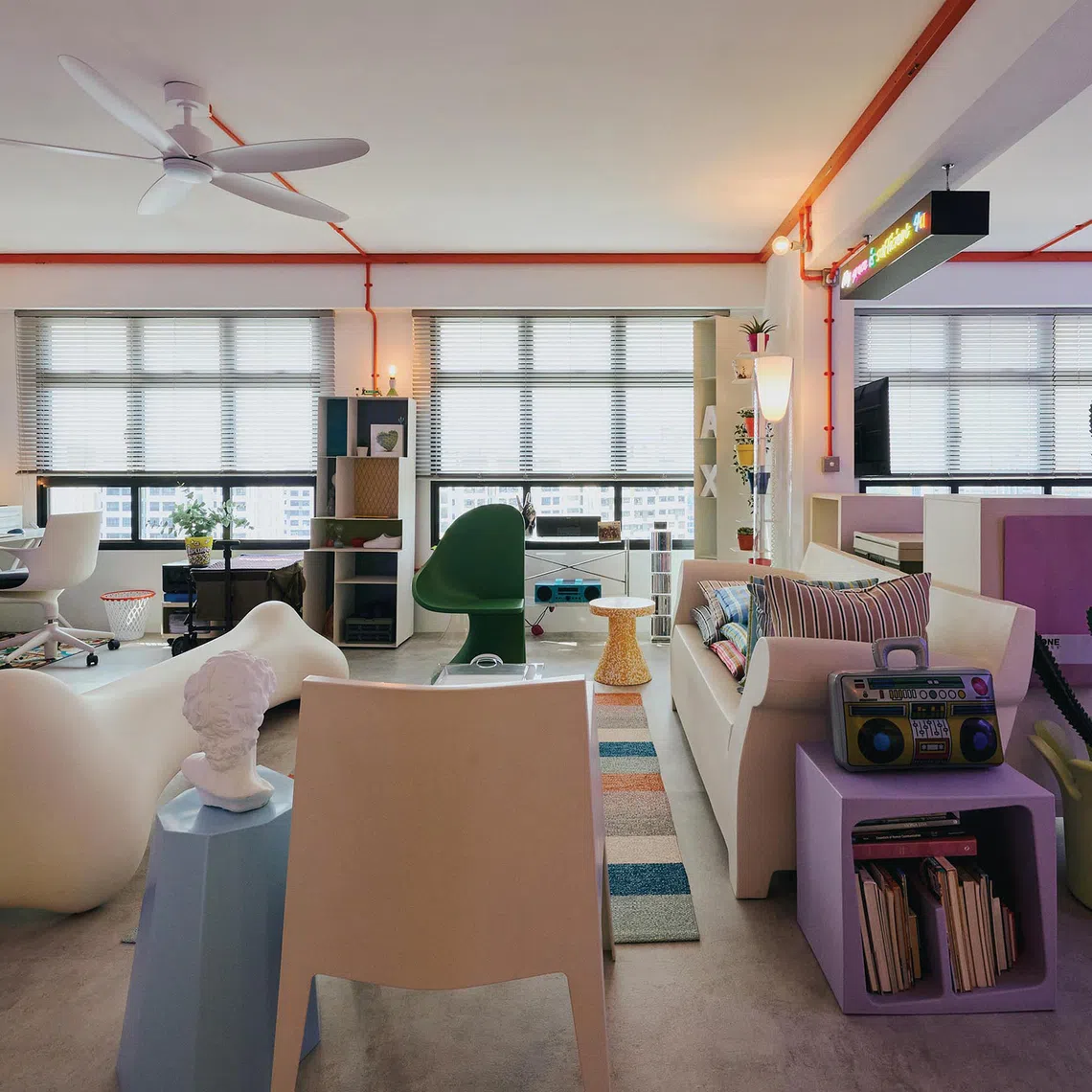 Cheerful colour and quirky collectibles bring life into this couple's four-room flat.