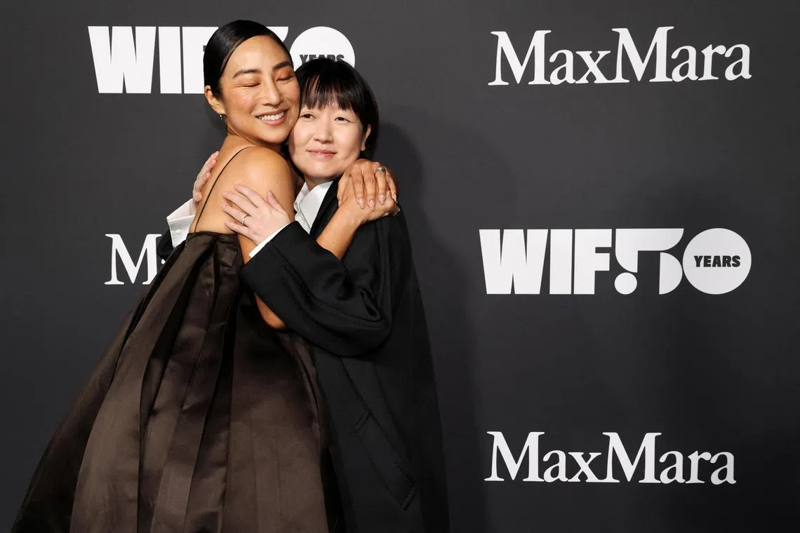 Greta Lee (left) and Celine Song attend the Women In Film (WIF) Honors event in Los Angeles, California, on November 30, 2023. 