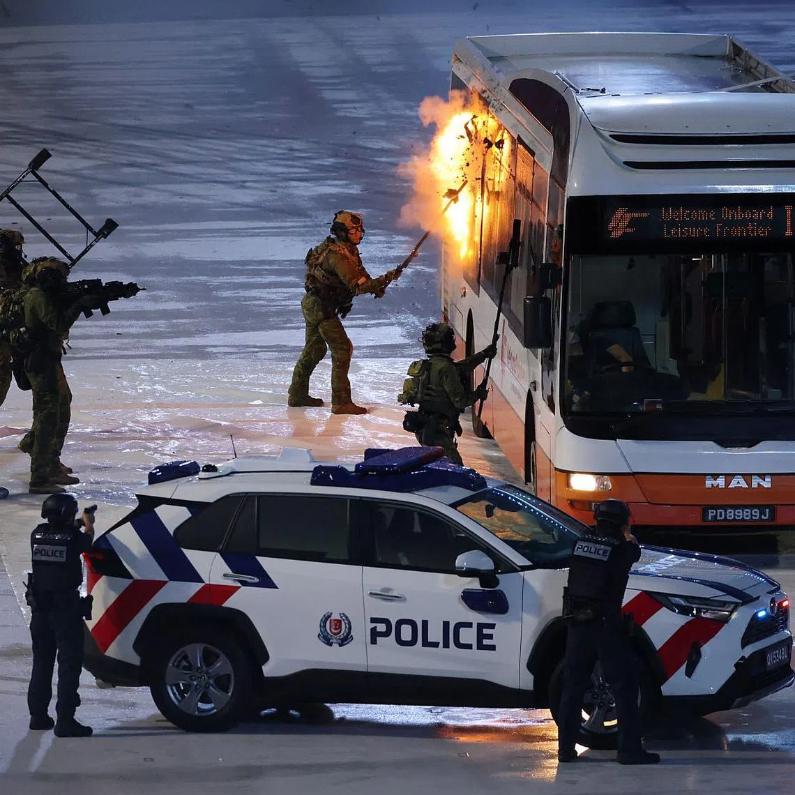 The SAF's Special Operations Task Force simulating the storming of a hijacked bus during the Total Defence Display on Aug 9.