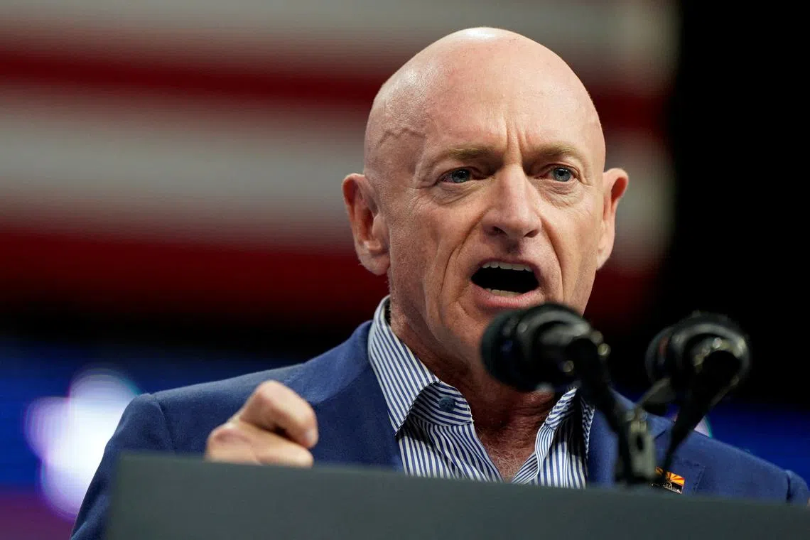 FILE PHOTO: Senator Mark Kelly (D-AZ) speaks during a campaign rally held along with U.S. Vice President and Democratic presidential candidate Kamala Harris and Democratic vice presidential candidate, Minnesota Governor Tim Walz, in Glendale, Arizona, U.S., August 9, 2024. REUTERS/Elizabeth Frantz/File Photo