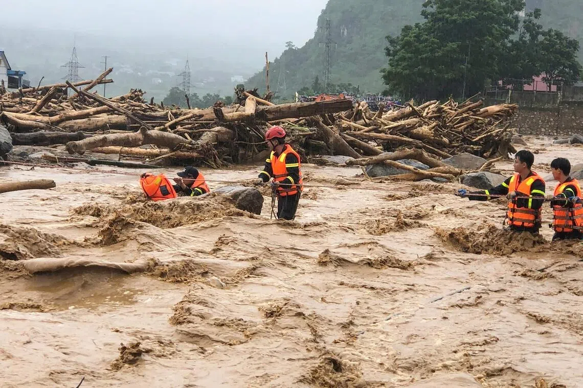 Rescue workers battling flash floods in Muong Than village, Lai Chau province, northern Vietnam.