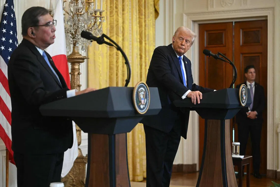 US President Donald Trump (right) and Japanese Prime Minister Shigeru Ishiba hold a joint press conference at the White House on Feb 7.